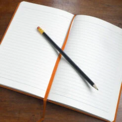 Personalised Personalised Notebook - Name & Decorated Border 13 Personalised Personalised Notebook - Name & Decorated Border -Literary Gift Shop open notebook on table orange