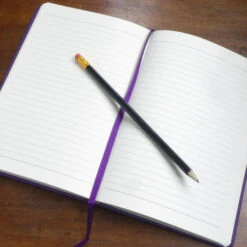 Personalised Personalised Notebook - Decorated Initial -Literary Gift Shop open notebook on table purple